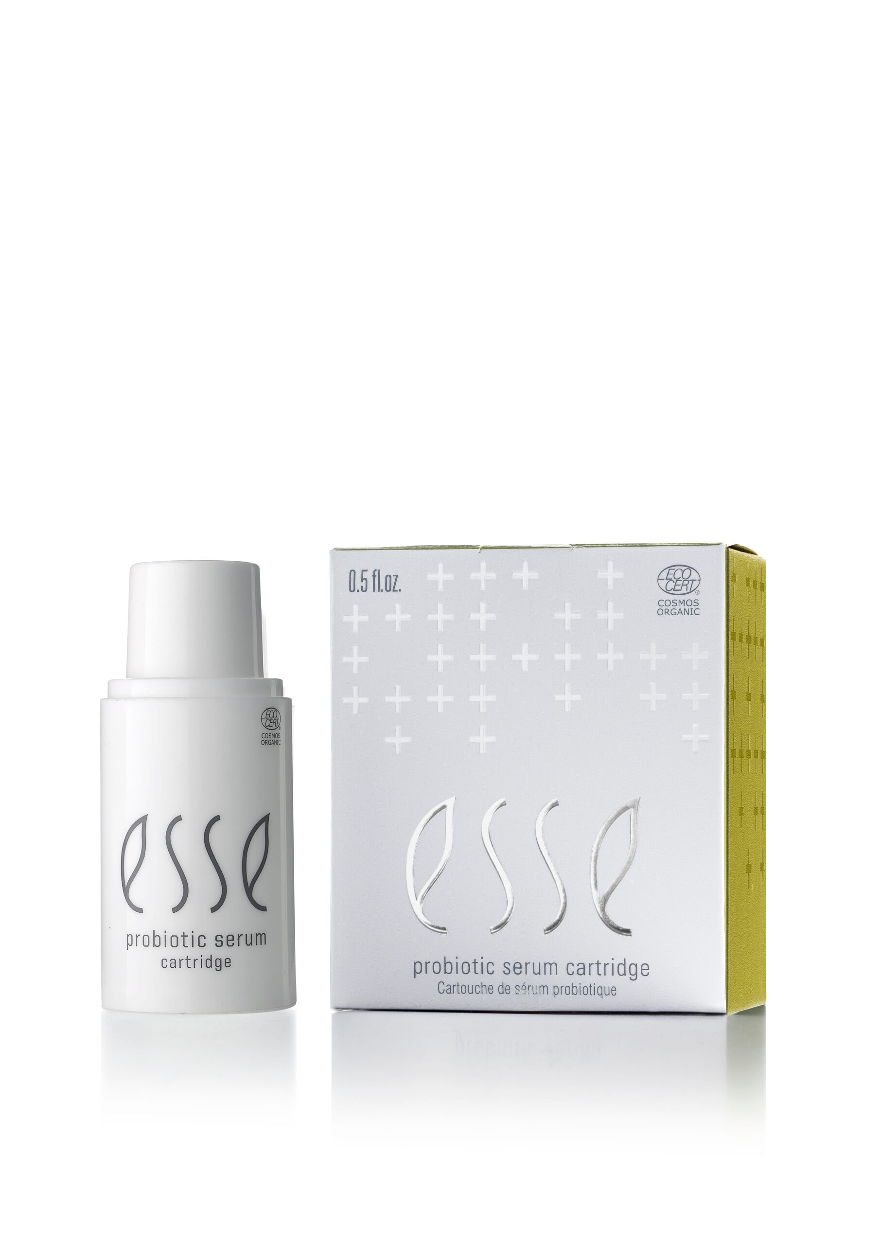 A white bottle labeled "Esse Probiotic Serum" stands next to its matching white and yellow box, which displays the product name, volume (0.5 fl. oz), and decorative plus symbols.